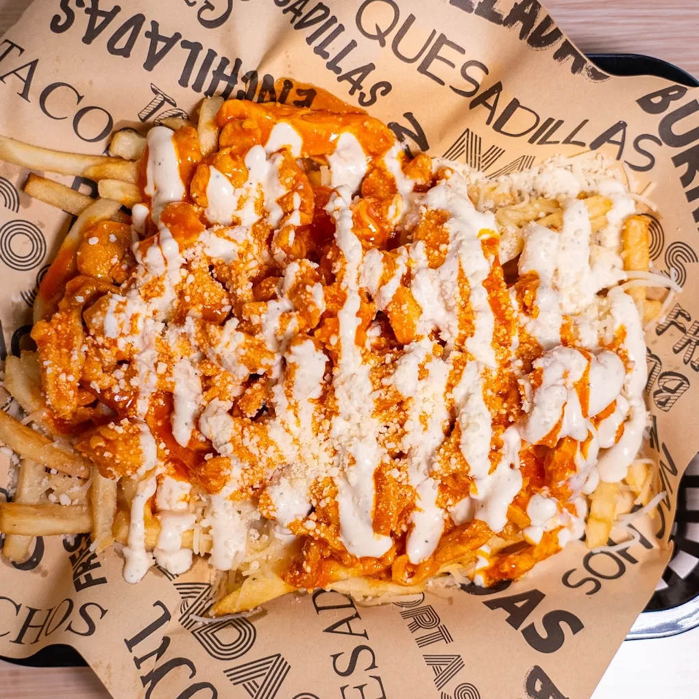 Loaded fries with cheese and orange sauce