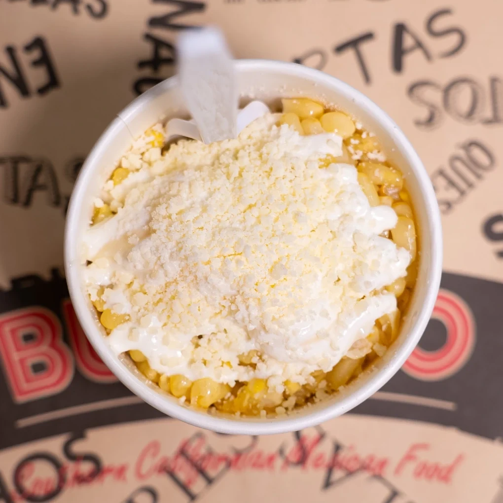 A bowl finished with crema and grated cheese