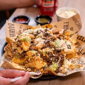 A basket of loaded nachos
